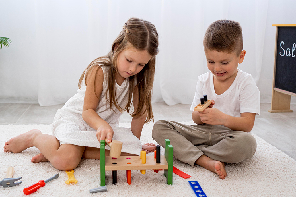 One boy and a girl are playing with toys